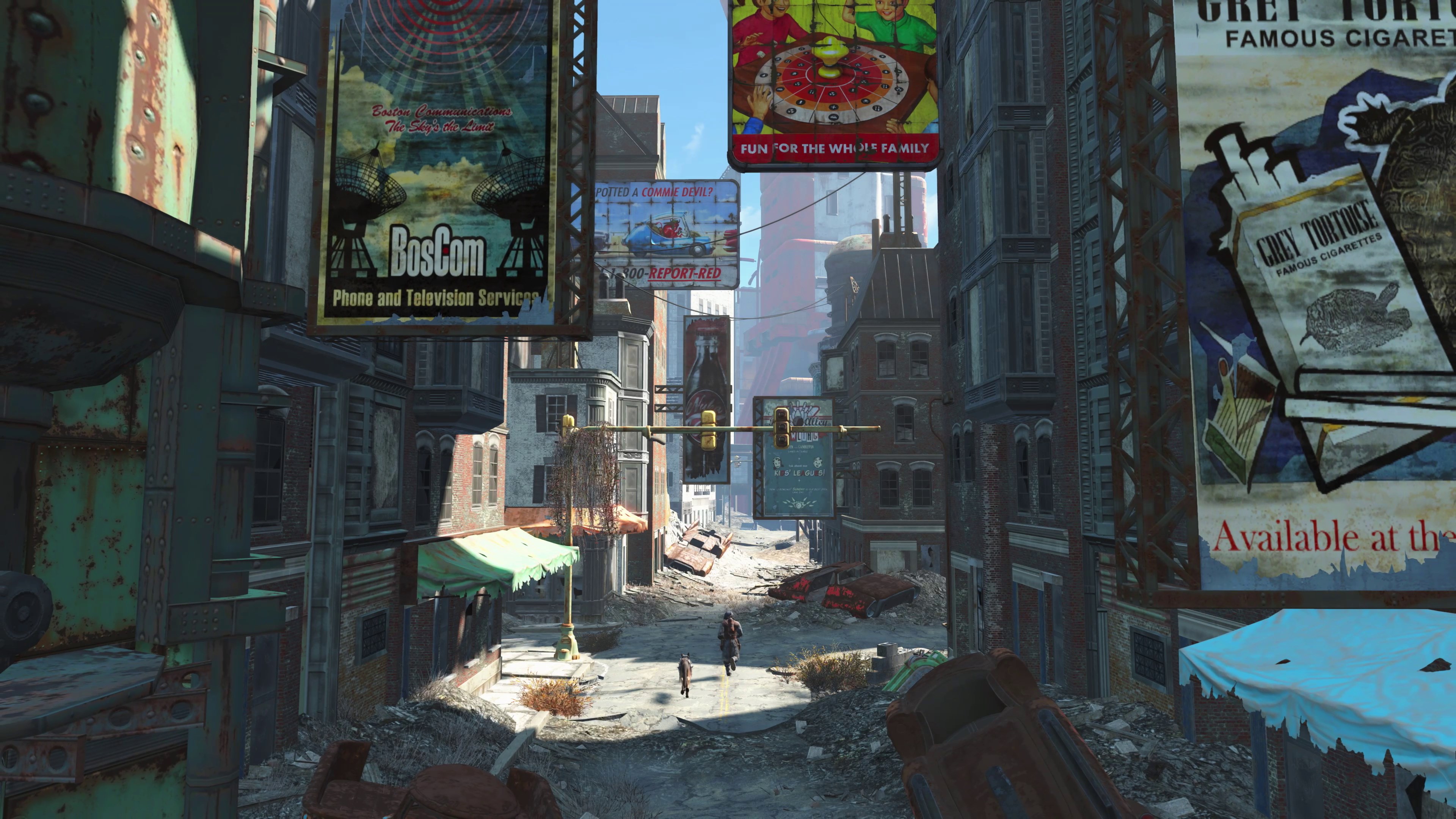 Fallout 4: Anniversary Edition - Lone Survivor and Dogmeat walk through a ruined city street lined with old billboards. 